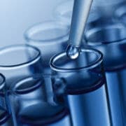 iStock_000011356107Small A close-up image of a liquid being added to a test tube with a dropper