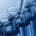 A close-up image of a liquid being added to a test tube with a dropper