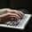 Woman's hands on laptop keyboard